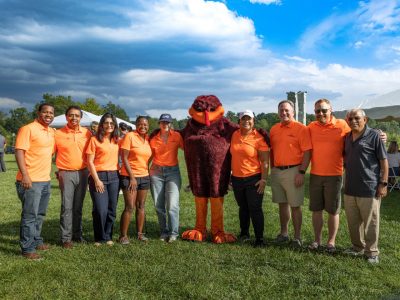 Executive PhD students join the Hokie Bird at the Pamplin College of Business Fall Picnic networking event.