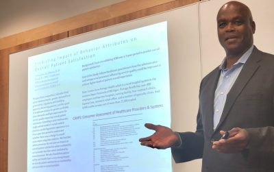 Quinton Nottingham, chair of the business information technology department, addresses an Executive Ph.D. class in Falls Church, VA